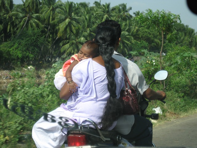 Baby balancing on motor bike Baby balancing on motor bike
