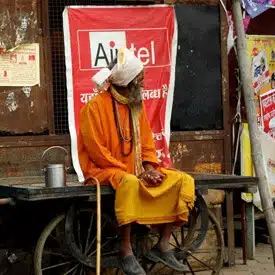 holy-man-in-front-of-airtel-shop-in-india