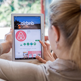 women booking Airbnb stay