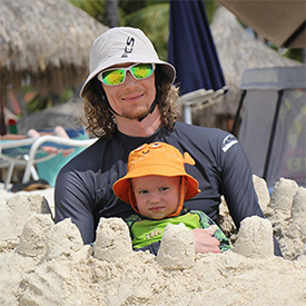 asher with kingsley at the beach in aruba