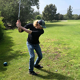 Asher Playing Golf on business trip