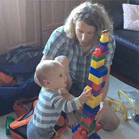 Us building a block tower in Sardinia, Italy.