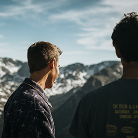 Friends looking at the rocky mountains