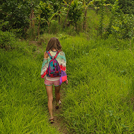 Woman hiking Kalalau Trail