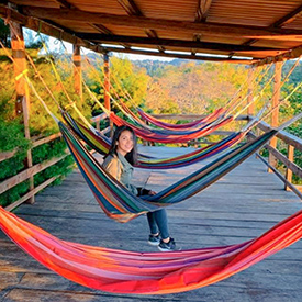 girl in hammock while glamping
