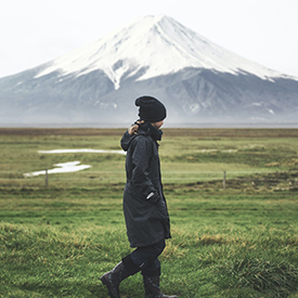 woman by mountain in the Fall