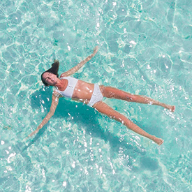 Woman floating in water