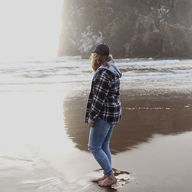 Woman walking along Oregon Coast
