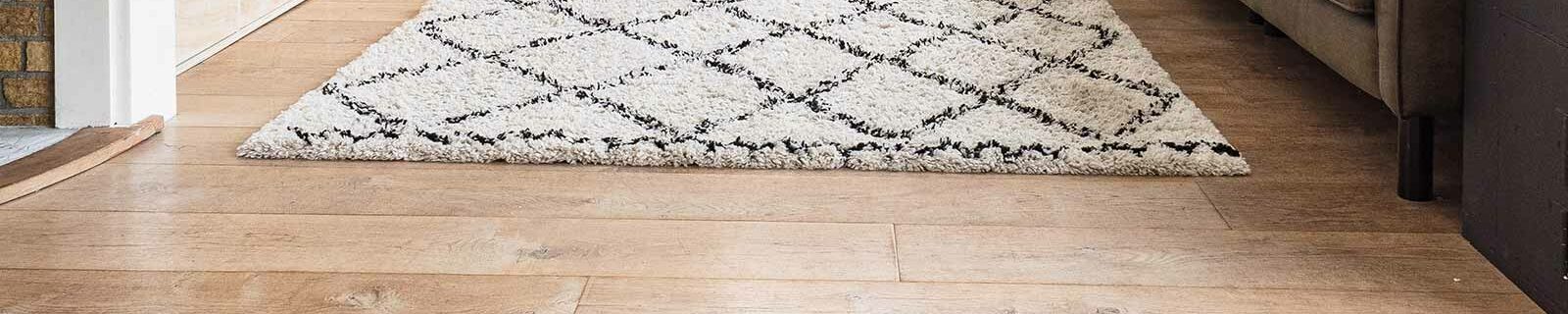 Wooden floor with rug