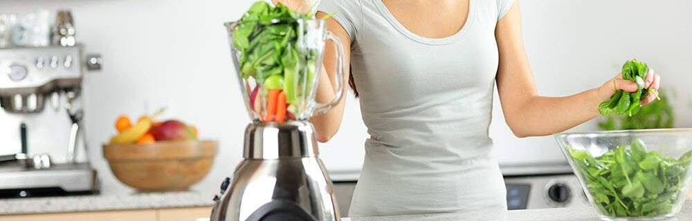 blender with greens inside