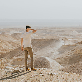 Guy looking out at desert in Israel