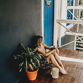 Woman outside hostel room