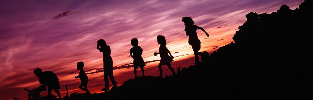 silhouette of children kids playing
