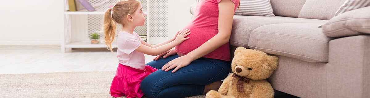 pregnant mom with daughter