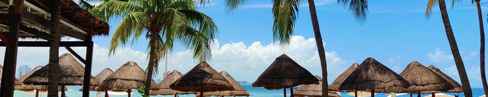 shady palapas on a cancun beach